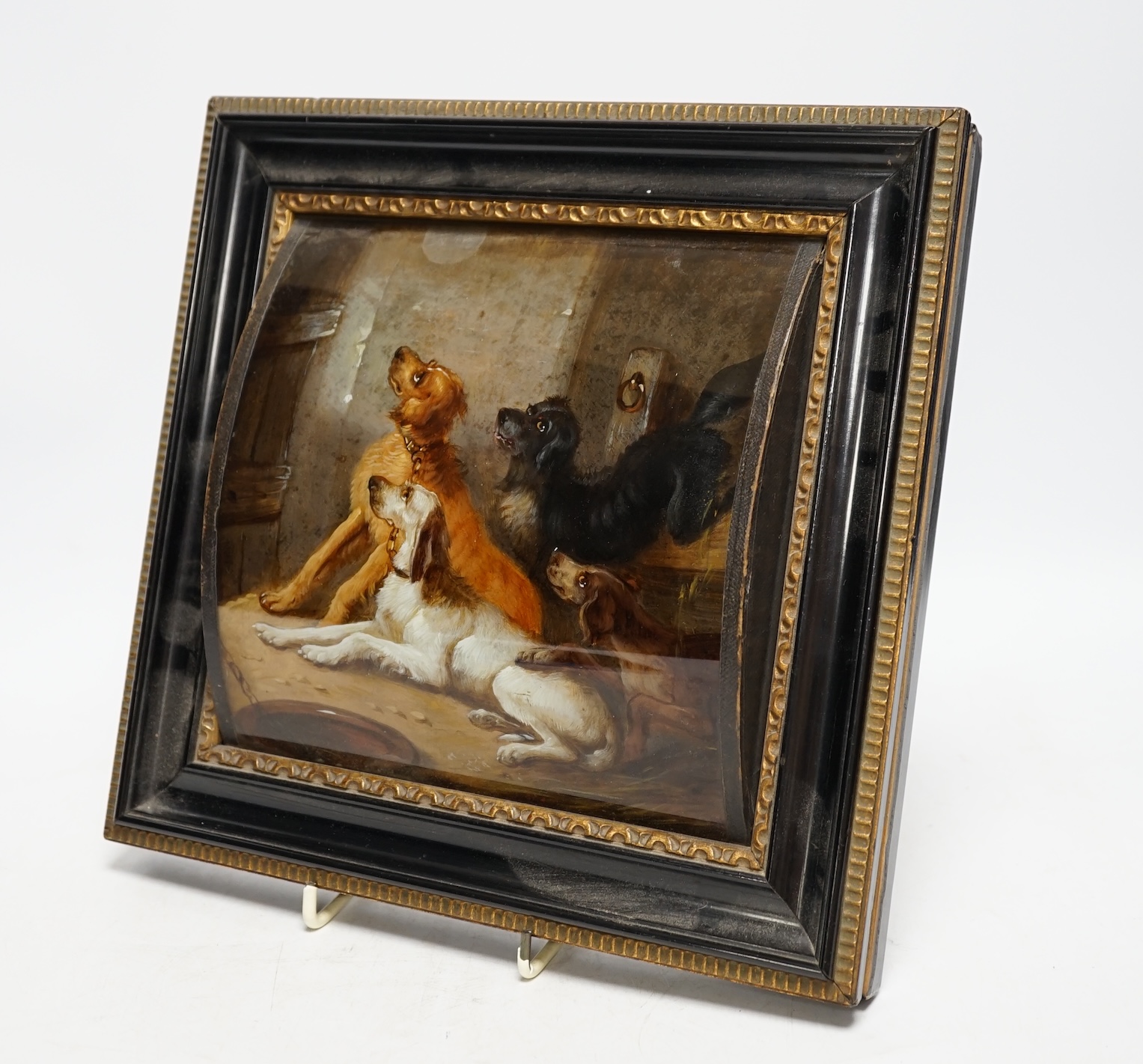 A framed reverse painted glass picture of four hounds, late 19th / early 20th century, 19cm wide, 18.5cm high. Condition - good